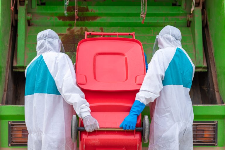 workers wearing PPE removing hazardous waste
