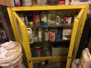chemicals in yellow cabinet